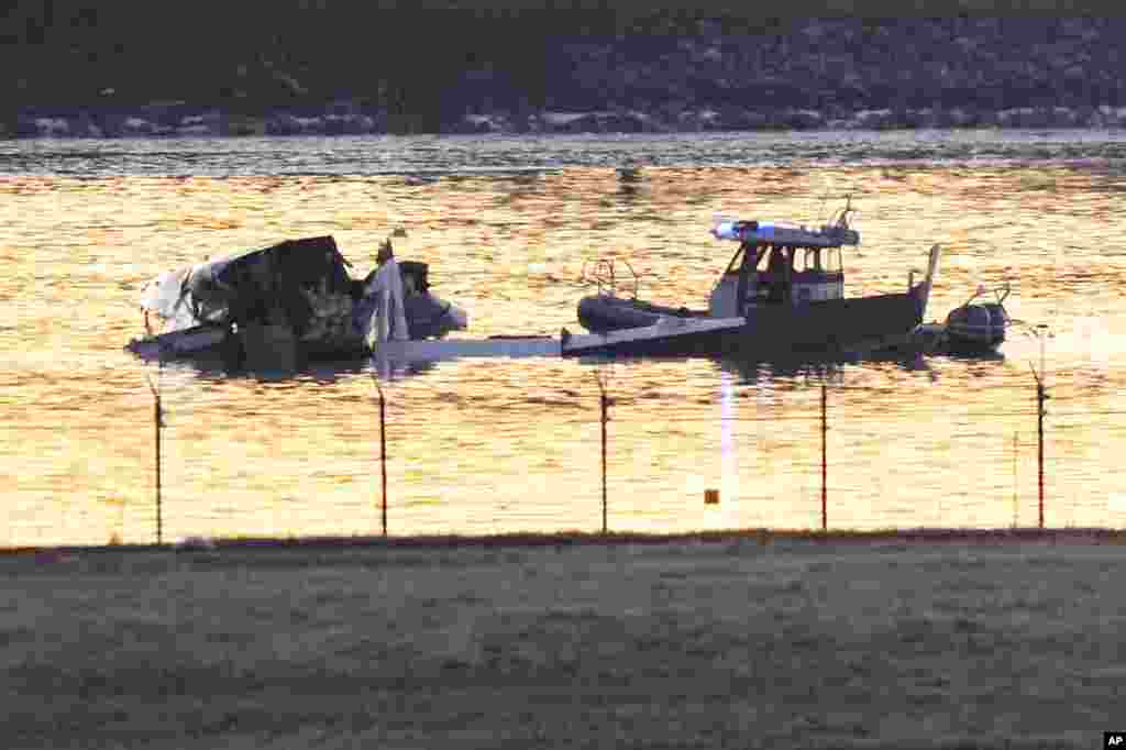 Search and rescue efforts are seen around a wreckage site in the Potomac River from Ronald Reagan Washington National Airport, Jan. 30, 2025, in Arlington.