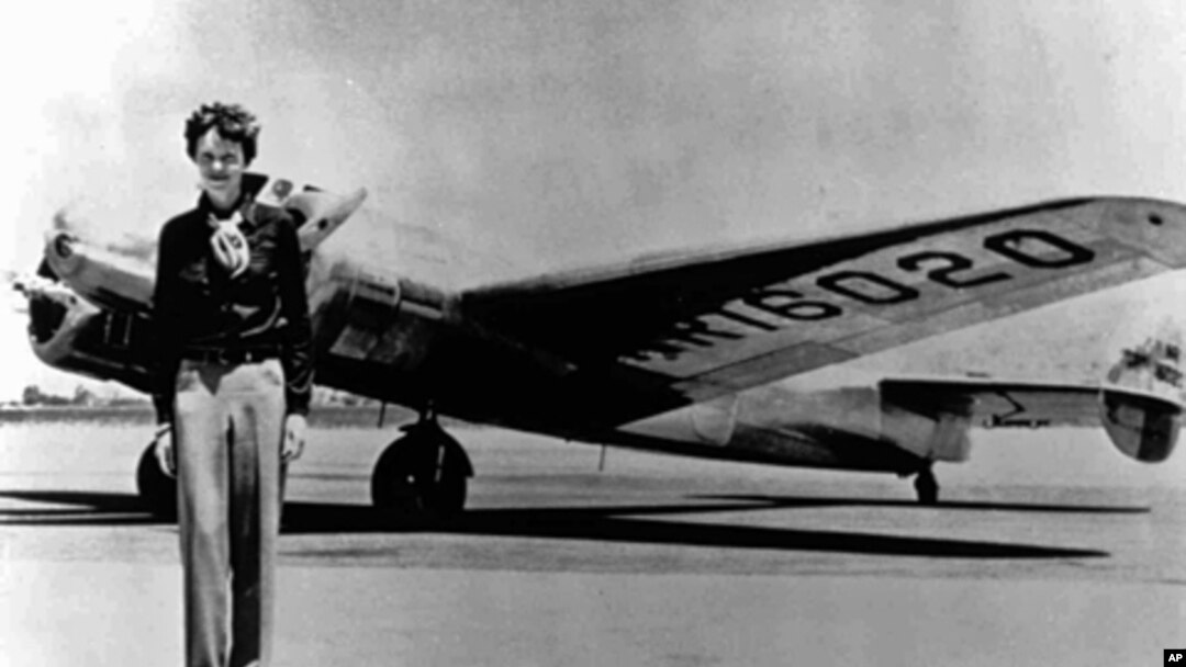 Amelia Earhart, 40, stands next to a Lockheed Electra 10E, before her last flight in 1937 from Oakland, Calif., bound for Honolulu.