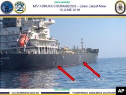 FILE - Image released by the U.S. military's Central Command, shows damage and a suspected mine on the Kokuka Courageous in the Gulf of Oman near the coast of Iran, June 13, 2019.