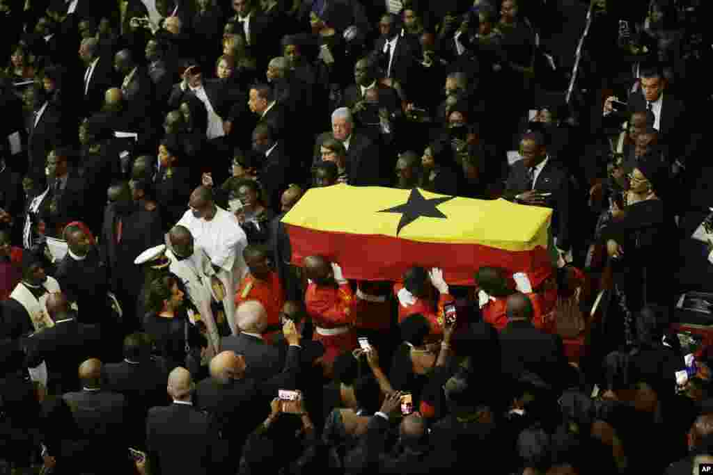 Ghanaian soldiers carry the coffin of former U.N. Secretary-General Kofi Annan, wrapped in the flag of Ghana, after a funeral service at the Accra International Conference Center.