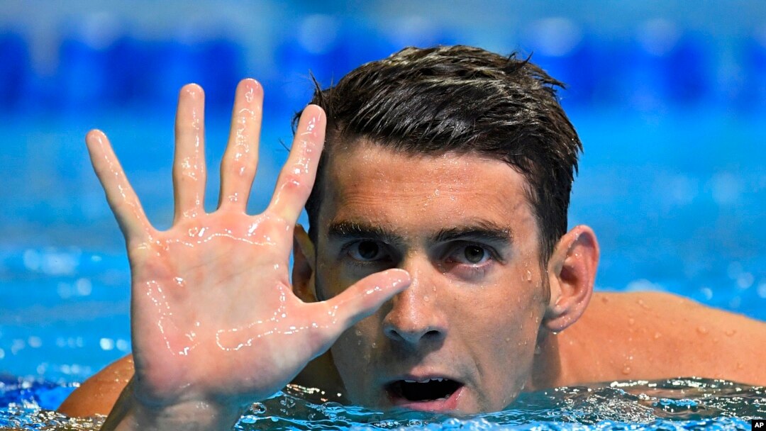 Michael Phelps gestures after winning the men's 200-meter butterfly at the U.S. Olympic swimming trials, Wednesday, June 29, 2016, in Omaha, Neb. Phelps qualified for his fifth Summer Games. 