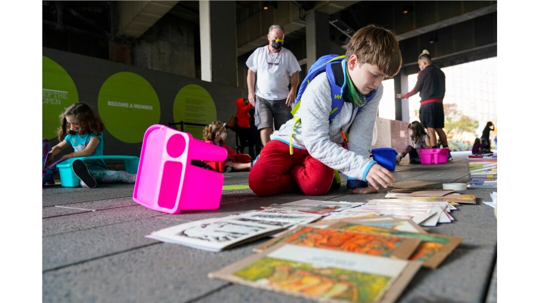 A students from Public School 11 picks out art supplies during an art class at the High Line Park Wednesday, Oct. 21, 2020, in New York. (AP Photo/Frank Franklin II)
