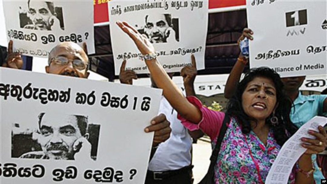 Sri Lankan media rights activists shout slogans during a protest in Colombo, Sri Lanka. Media rights groups' members demanded the government to inquire into the attacks and killings of journalists and punish the culprits, January 18, 2011.