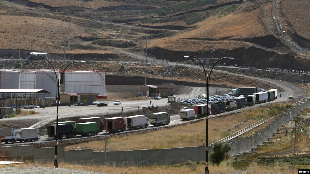 Trucks are seen at Haj Omran border, on the border between Iran and Kurdistan, Iraq, Oct. 14, 2017. 