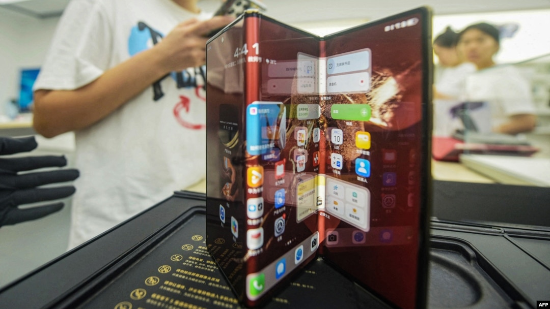 Chinese tech giant Huawei's new trifold phone, Mate XT, is displayed during its launch day at a Huawei store in Hangzhou, in eastern China's Zhejiang province, on Sept. 10, 2024.
