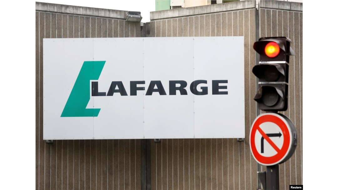 FILE - The logo of French concrete maker Lafarge is seen on the plant of Bercy on the banks of the river Seine in Paris, France, Sept. 3, 2020.