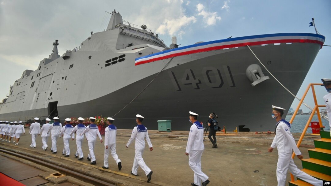 Taiwanese navy soldiers walk by a Yushan-class landing platform dock during in Kaohsiung on Sept. 30, 2022. 