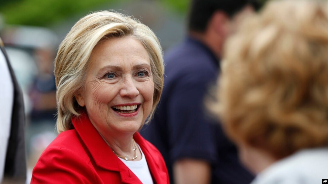 Democratic presidential candidate Hillary Clinton greets a spectator at a Fourth of July parade in Gorham, N.H., July 4, 2015.