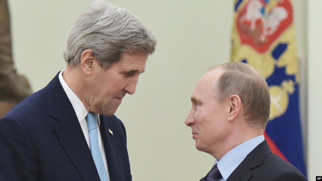 FILE - U.S. Secretary of State John Kerry, left, speaks with Russia's President Vladimir Putin during a meeting at the Kremlin in Moscow, Dec. 15, 2015.