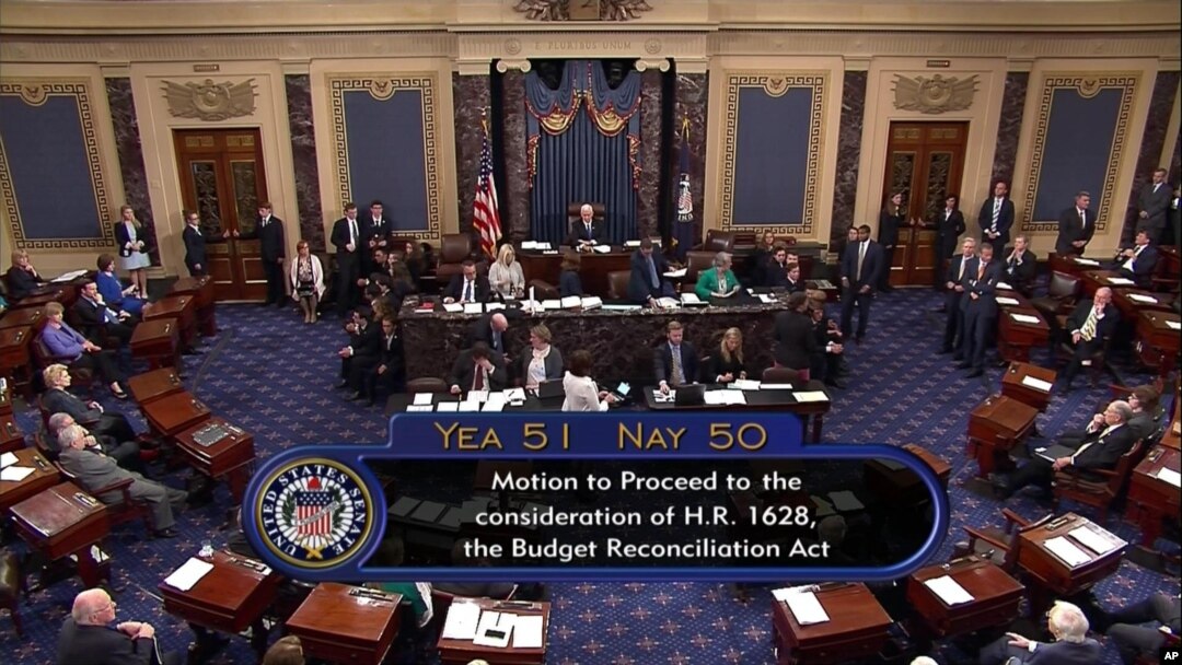 Image from video provided by C-SPAN2 shows the final Senate vote, with Vice President Mike Pence's vote, to start debate to tear down much of the Obama health care law, July 25, 2017, on the floor of the Senate on Capitol Hill in Washington.