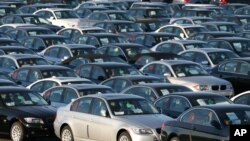 FILE - Imported German-made BMWs are parked at the North East Auto Terminal in Jersey City, N.J.