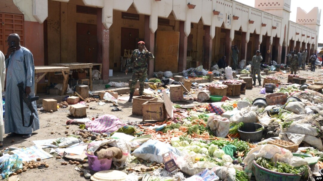 Soldiers guard a market in N'Djamena following a suicide bomb attack on July 11, 2015. 