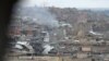 Mosul's Old City, seen through a sniper hole on the outskirts, is the scene of some of the fiercest fighting since operations to retake the city from IS militants began in October, March 25, 2017.
