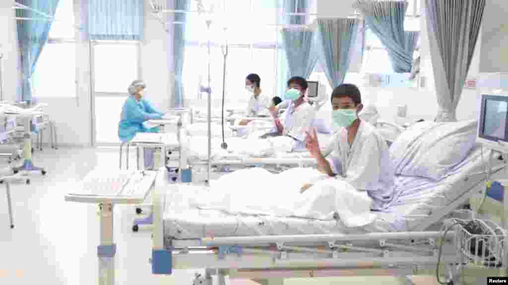 A screen grab shows boys rescued from the Thai cave wearing masks and resting in a hospital in Chiang Rai, Thailand. (Credit: Government Public Relations Department (PRD) and Government Spokesman Bureau)