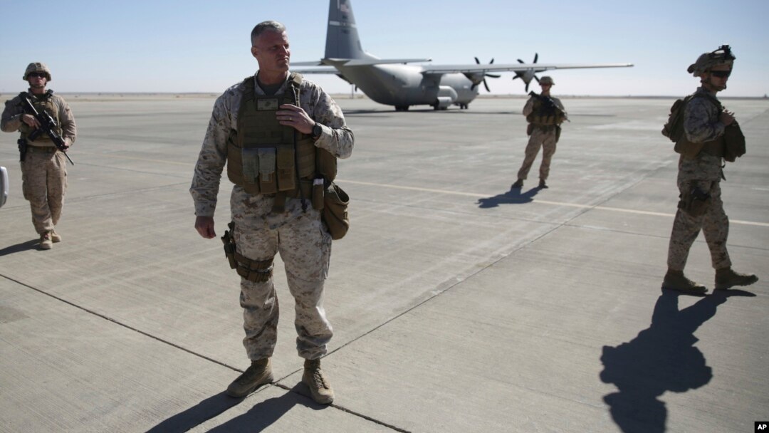 Out going U.S. Marine Brigadier Gen. Roger B. Turner walks on the airfield after the change of command ceremony in Shorab military camp of Helmand province, Afghanistan, Jan. 15, 2018. 