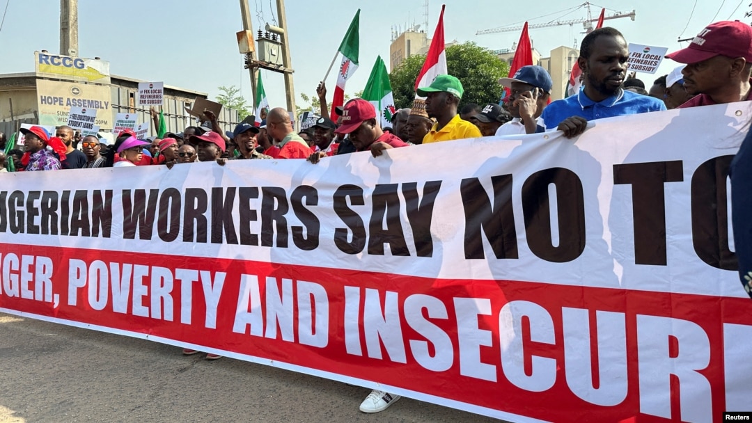 FILE - Nigerians protest against high cost of living and massive suffering following an increase in fuel prices in Abuja, Nigeria, Feb. 27, 2024.