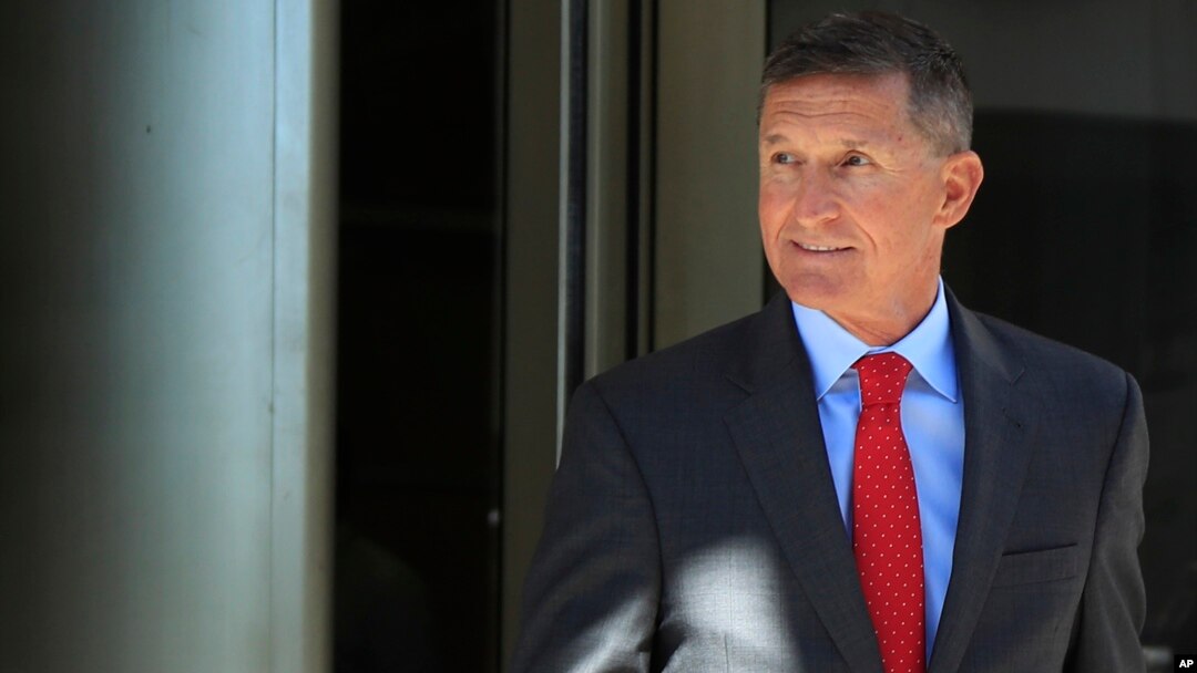 FILE - Former Trump national security adviser Michael Flynn leaves federal courthouse in Washington, July 10, 2018, following a status hearing.