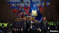 Security forces of Kosovo march at a parade during celebrations of the 15th anniversary of Kosovo independence in Pristina, Kosovo, Feb. 17, 2023.