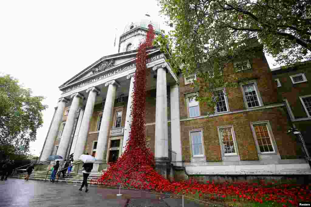 An installation called 'Weeping Window', comprised of thousands of ceramic poppies on the outside of the Imperial War Museum in London, Britain, Oct. 6, 2018.