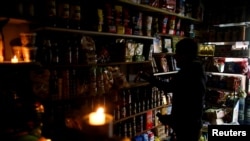 A vendor waits for customers during a national blackout, in Buenos Aires, Argentina, June 16, 2019. 
