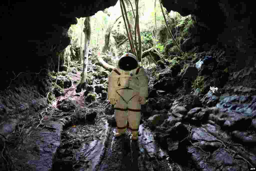 Peter Weiss, director of the Space Department of COMEX, tests a pressurized suit identical to those used in space expeditions in the lava tunnel of "Caverne Gendarme" in Saint-Philippe, the French overseas island of Reunion.