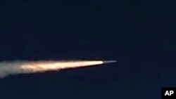 FILE - This photo made from footage taken from the Russian Defense Ministry web site on March 11, 2018, shows the Kinzhal hypersonic missile flying during a test in southern Russia.