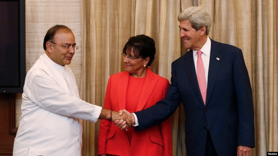 U.S. Secretary of State John Kerry (R) shakes hands with India's Finance Minister Arun Jaitley as U.S. Commerce Secretary Penny Pritzker (C) watches before the start of their meeting in New Delhi, July 31, 2014.