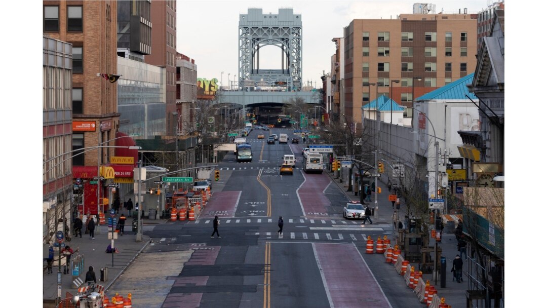 There is little traffic on 125th Street, April 16, 2020, in the Harlem neighborhood of New York during the coronavirus pandemic.
