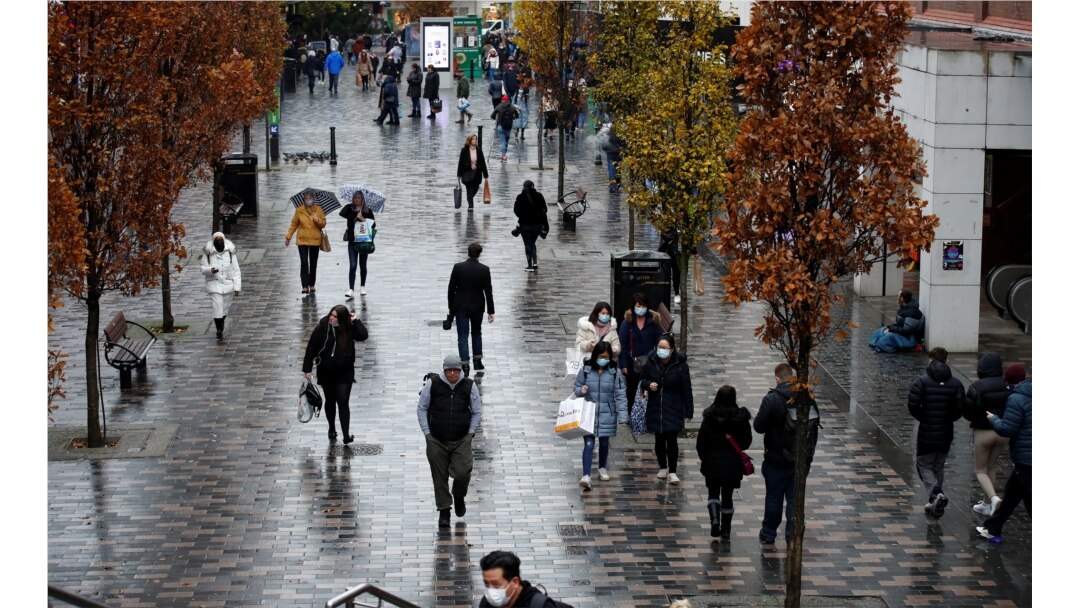 Shoppers walk through the Liverpool City Centre, in Liverpool, Britain, Dec. 13, 2021.