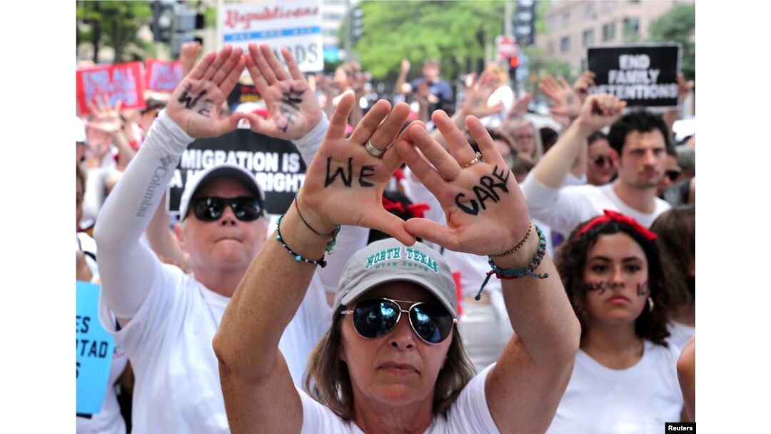 Immigration activists rally as part of a march calling for "an end to family detention" and in opposition to the immigration policies of the Trump administration, in Washington, June 28, 2018.