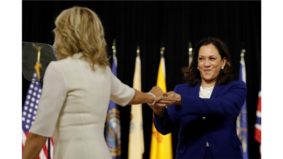 Democratic presidential candidate and former Vice President Joe Biden's wife, Jill Biden, and vice presidential candidate Senator Kamala Harris are seen on stage in Wilmington, Delaware, Aug. 12, 2020.