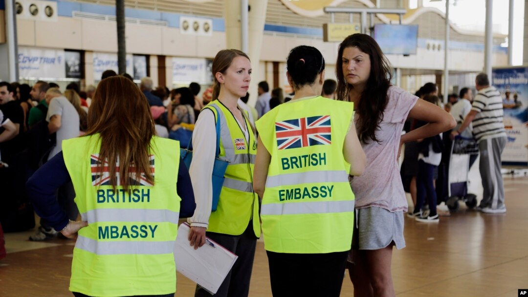 British Embassy staff assist in the evacuation of tourists at the Sharm el-Sheikh International Airport, south Sinai, Egypt, Nov. 6, 2015.