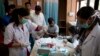 A patient has his blood taken to be tested at a fever clinic especially set up to cater to those suffering from fever, one of the main symptoms of several mosquito-borne diseases such as dengue, at a hospital in New Delhi, India, Sept. 15, 2016. The World