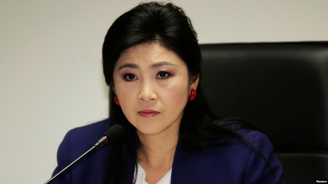 FILE - Prime Minister Yingluck Shinawatra attends her cabinet economic meeting at the office of the Permanent Secretary of Defense in Bangkok.