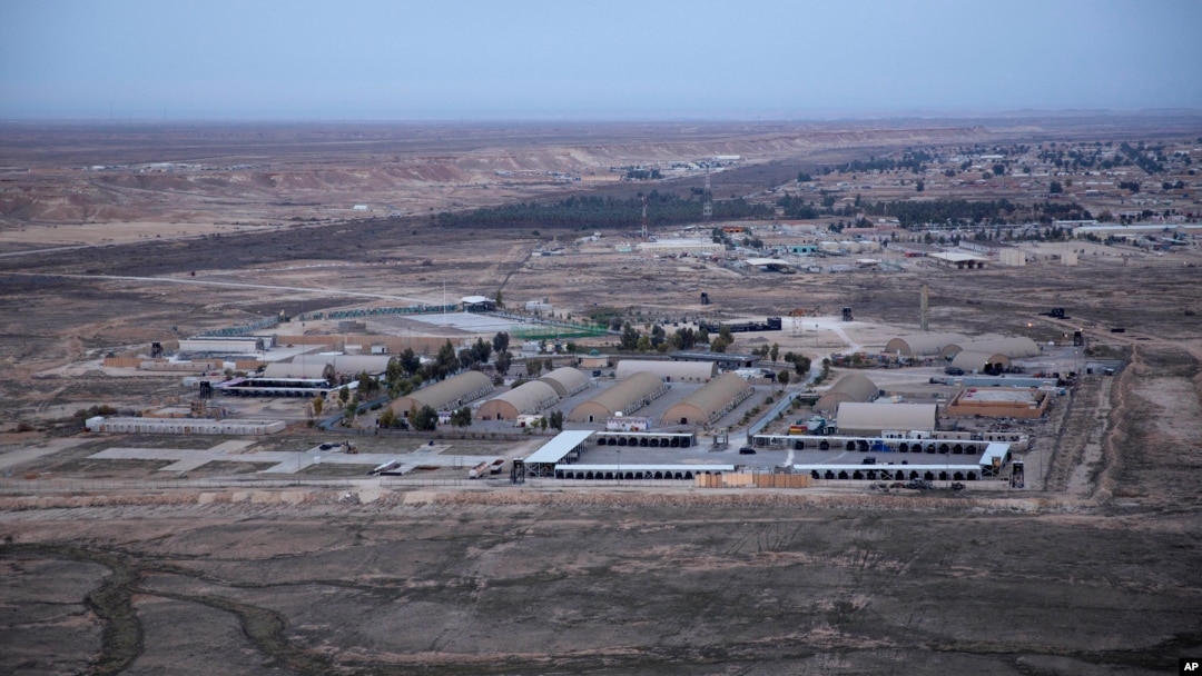 FILE - An aerial photo taken from a helicopter shows al-Asad Air Base in the western Anbar desert, Iraq, Dec. 29, 2019. It was one of the sites where U.S. forces have been attacked with drones or rockets in October 2023. 