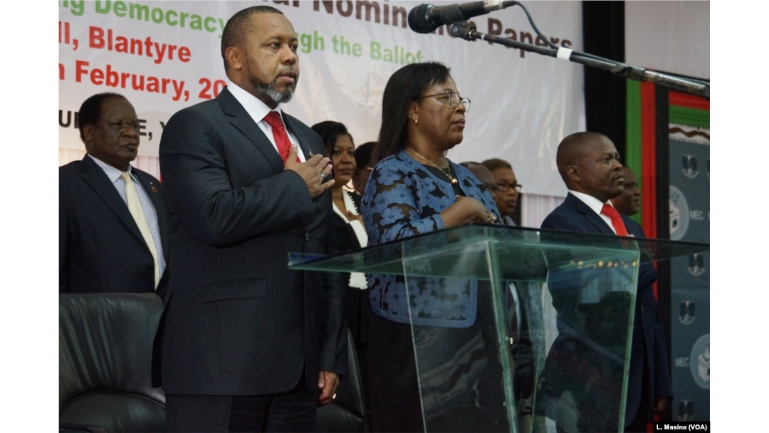 Vice President Saulos Chilima (left) and MEC chairperson Jane Ansah and others standing attention for the Malawi National Anthem during the nominantion presentation ceremony in Blantryre.