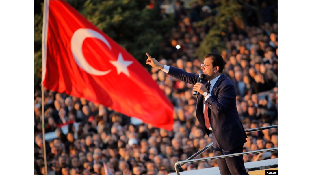 FILE - Newly elected Mayor of Istanbul Ekrem Imamoglu addresses his supporters outside the City Hall in Istanbul, Turkey, April 17, 2019.