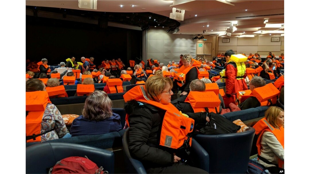 This photo provided by Michal Stewart shows passengers on board the Viking Sky, waiting to be evacuated, off the coast of Norway, March 23, 2019.