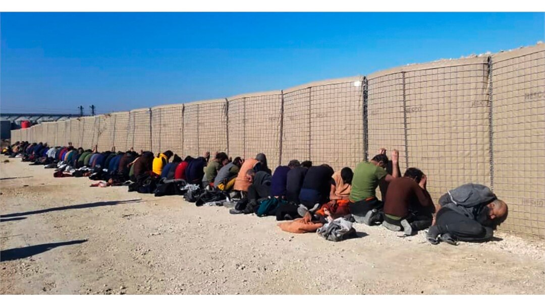 This photo provided by the Kurdish-led Syrian Democratic Forces shows some Islamic State group fighters, who were arrested by the Kurdish-led Syrian Democratic Forces after they attacked Gweiran Prison, in Hassakeh, northeast Syria, Jan. 21, 2022.