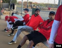 Danish Bashir sits in the dugout at a softball game in Springfield, Virginia. (C. Presutti/VOA)