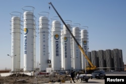 FILE - A liquefied natural gas storage facility of the ENN Group Co is under construction in Baoding, Hebei province, China, Dec. 5, 2017.