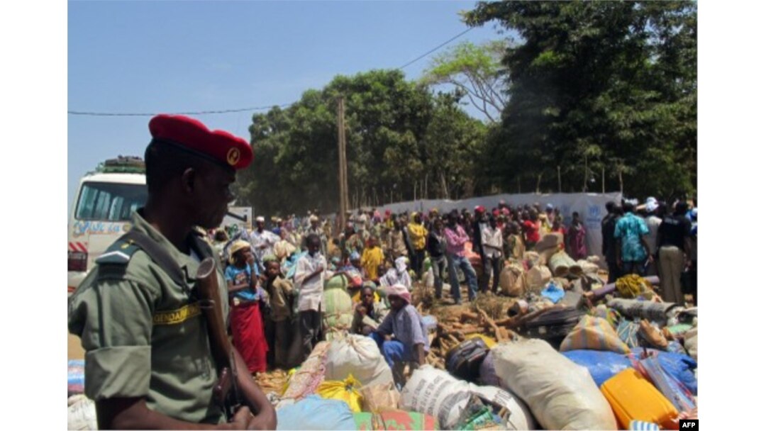 FILE - Refugees from Central Africa Republic wait for a food distribution at an UNHCR refugee camp in the eastern Cameroonian city of Garoua-Boulai, not far from the border with Central Africa Republic, March 13, 2014.