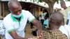 A man is administered a Moderna COVD-19 vaccine outside a mosque on the outskirts of Abuja, Nigeria, Oct. 8, 2021.