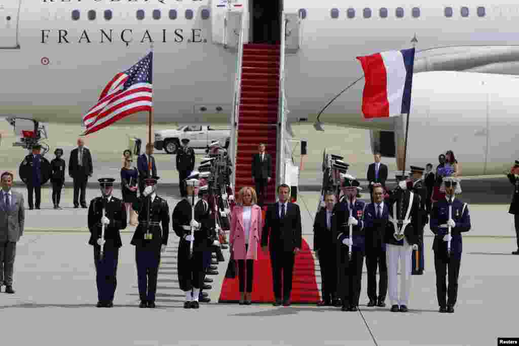 French President Emmanuel Macron and his wife Brigitte Macron arrive for their state visit to Washington and meetings with U.S. President Donald Trump after landing at Joint Base Andrews in Maryland, April 23, 2018.