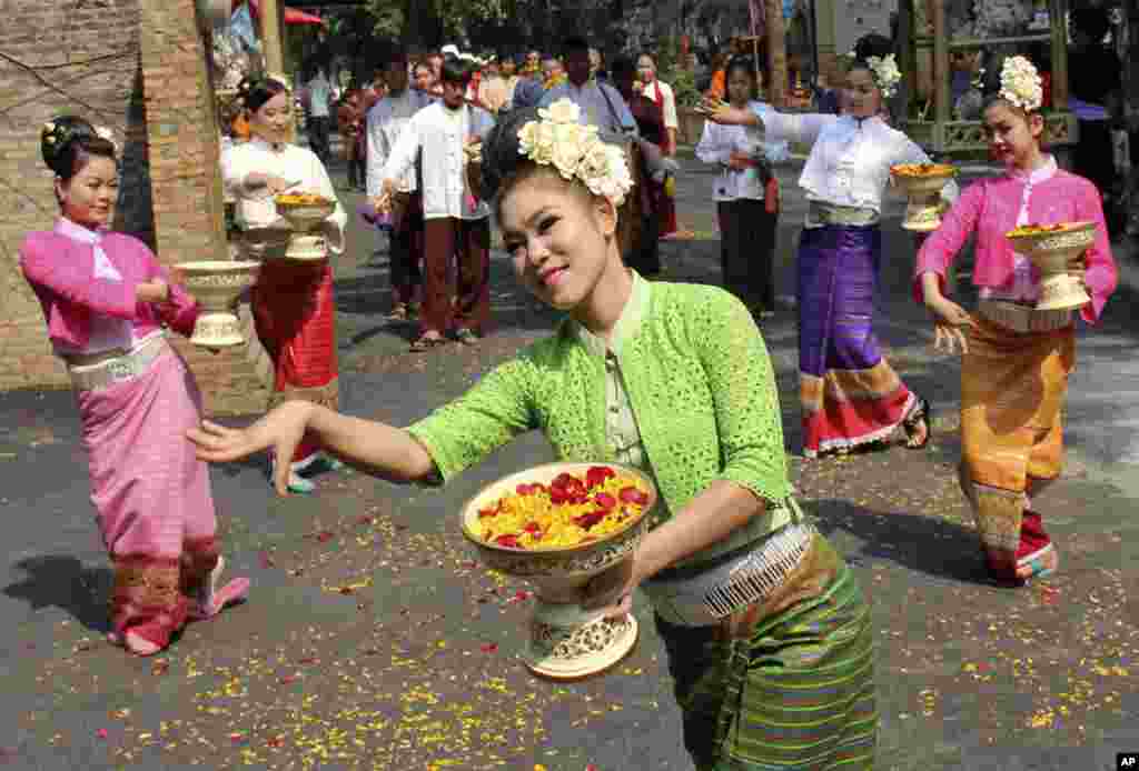 Dancers perform a traditional dance during the opening ceremony of ancient Thai New Year or Songkran festival celebrations in Chiang Mai province, northern Thailand. The festival starts on April 13, 2014.