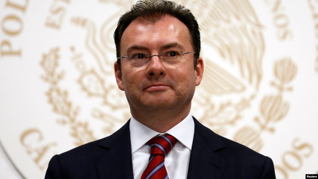 FILE - Mexico's Finance Minister Luis Videgaray looks on after handing in fiscal reforms to congressmen at the Congress building in Mexico City, September 2013.