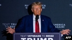 FILE - Former US president and 2024 presidential hopeful Donald Trump speaks during a campaign rally at Windham High School in Windham, New Hampshire, on Aug. 8, 2023.