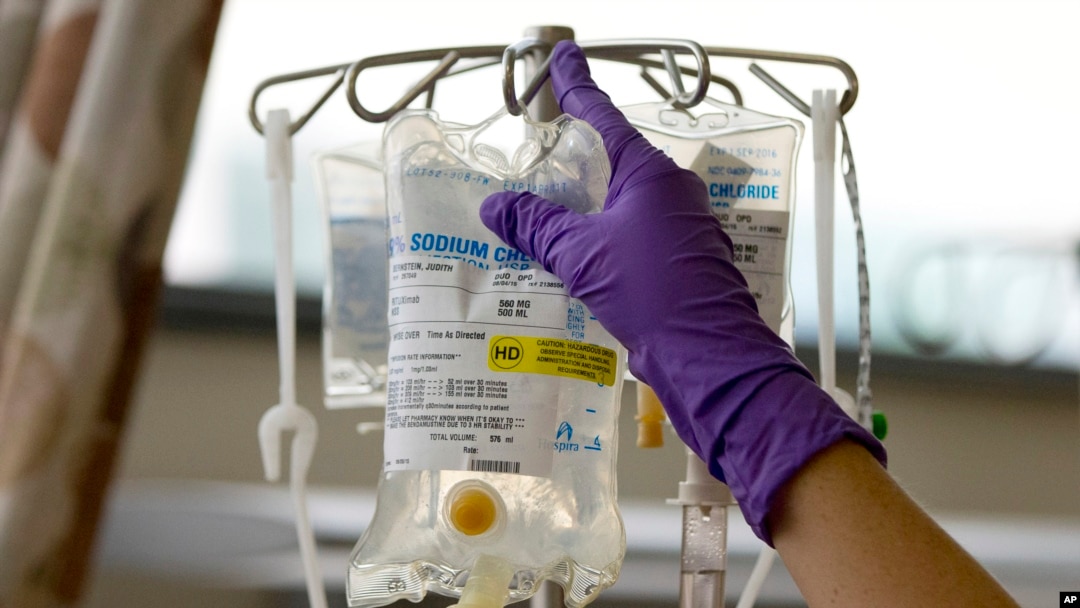 FILE - A nurse places chemotherapy medication on an intravenous stand at the Fox Chase Cancer Center in Philadelphia.
