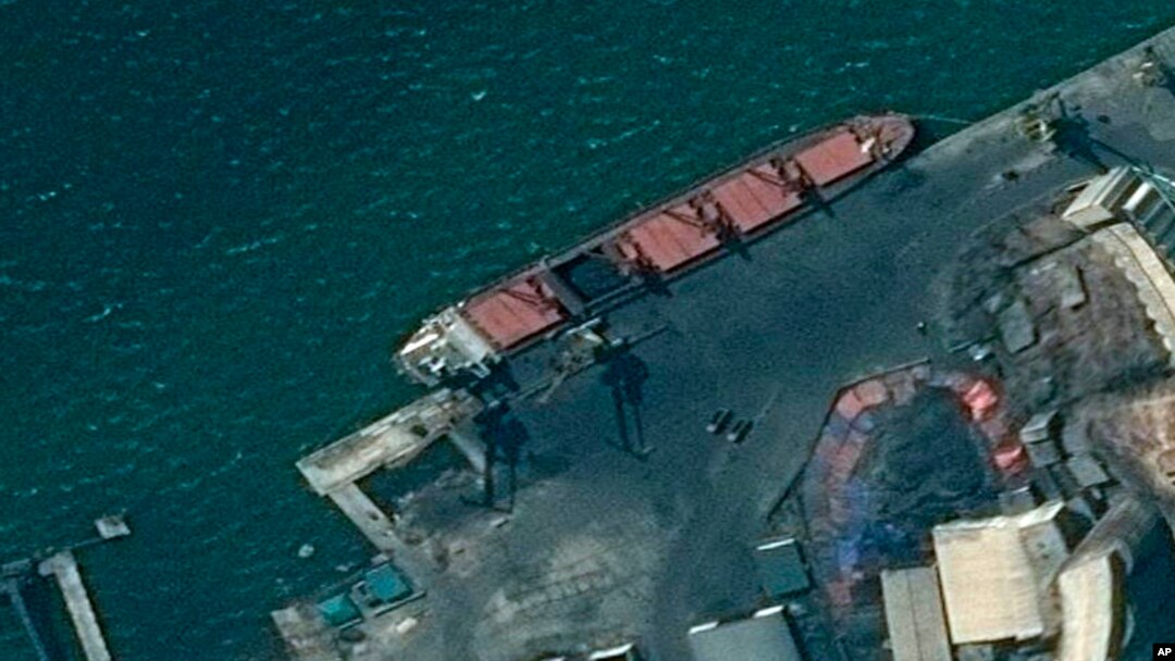 This satellite image provided by the Department of Justice shows what the DoJ says is the North Korean cargo ship Wise Honest docked at a unknown port. (Department of Justice via AP)