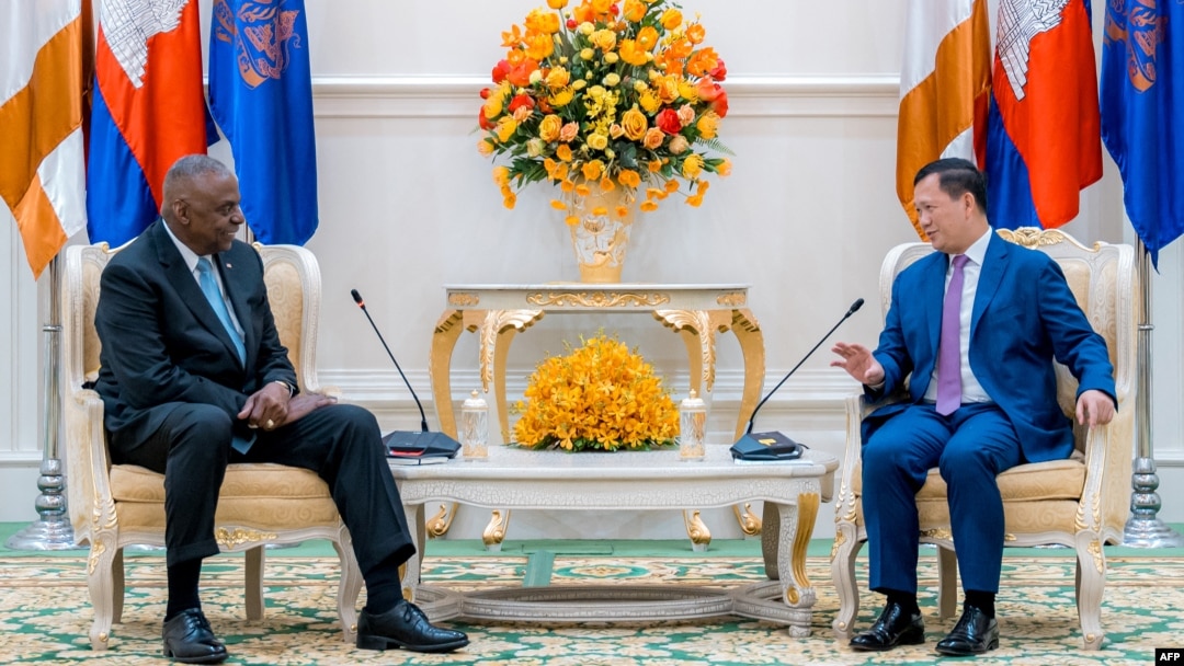 FILE - U.S. Defense Secretary Lloyd Austin, left, listens as Cambodia's Prime Minister Hun Manet speaks during a meeting at the Peace Palace in Phnom Penh on June 4, 2024.
